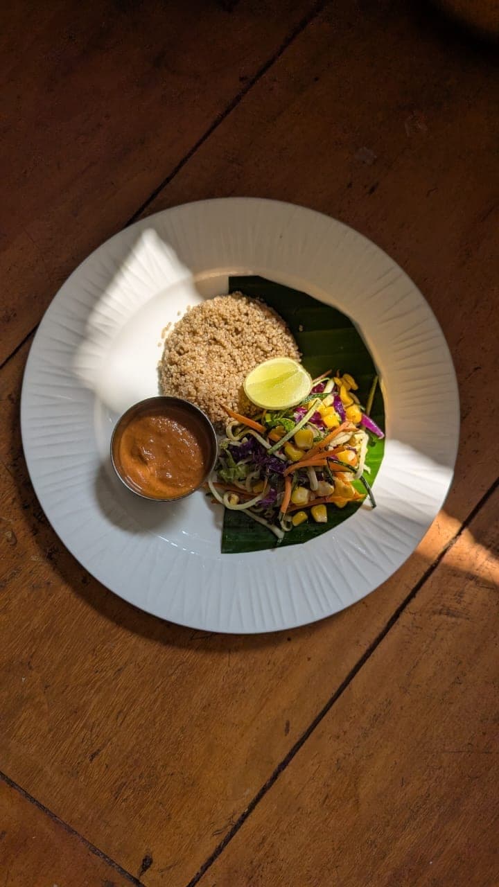 Rice and salad on a banana leaf with fresh chutney