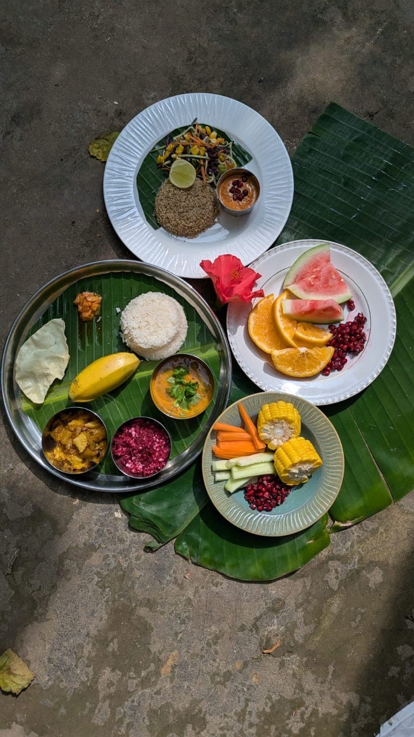 A colourful banana-leaf spread of rice, vegetables and fruit