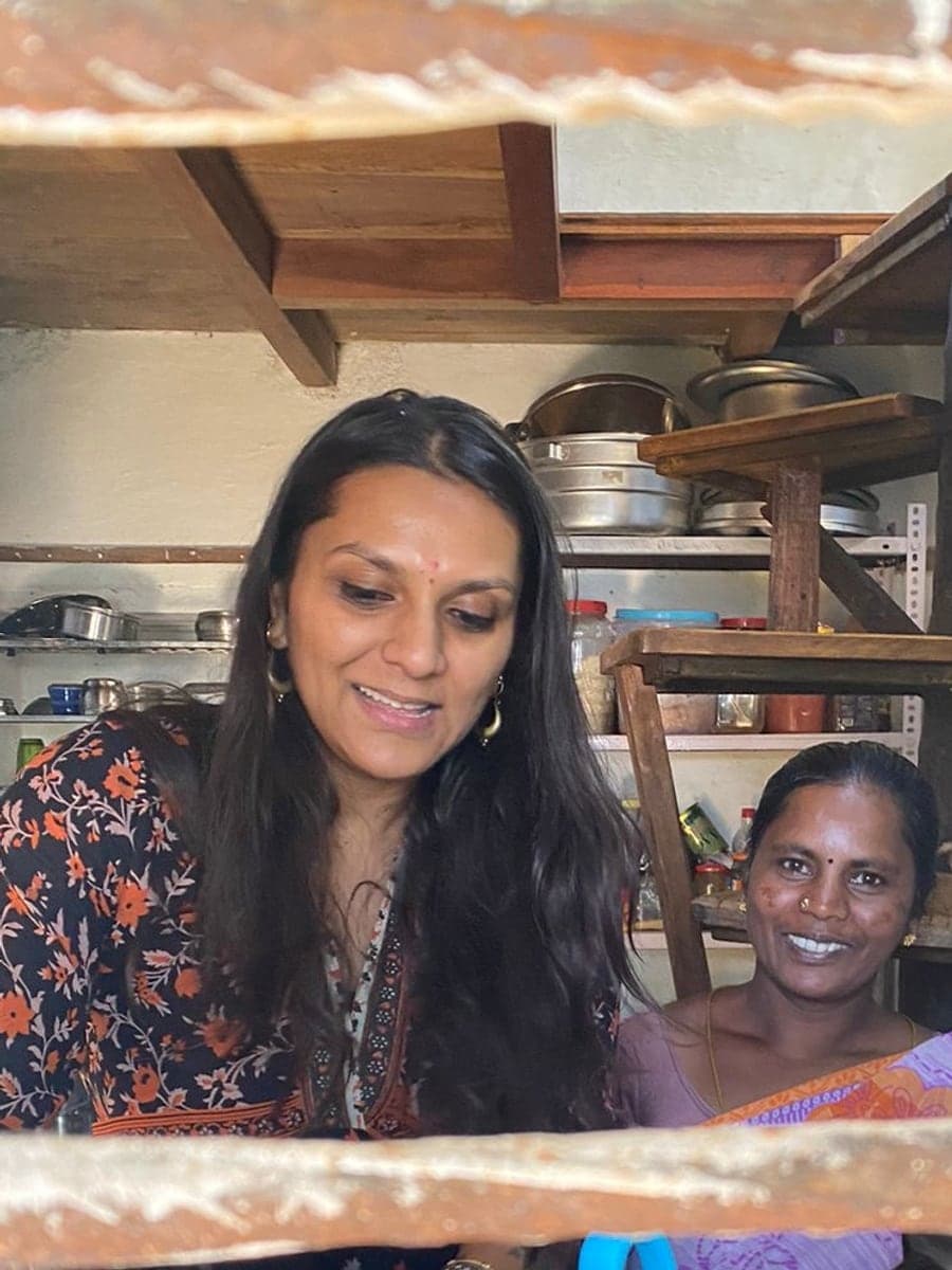 Nikhita smiling in the kitchen at Shanti Earth